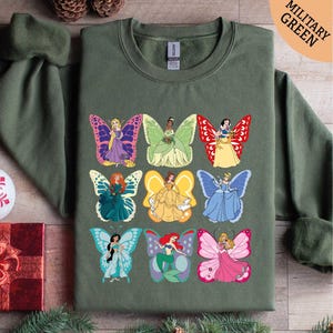 a green shirt with disney characters on it