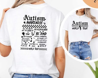 May include: White t-shirt with black text that reads "Autism. *AWARENESS" and includes a list of phrases about autism awareness. The back of the shirt has a checkered pattern with the words "WORLD TOUR".