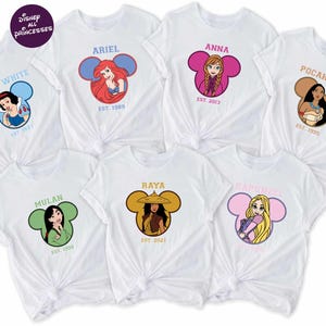 a collection of white t-shirts featuring Disney princesses, including Snow White, Ariel, Pocahontas, Mulan, Baya, Rapunzel, and Rapunzel.
