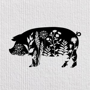 May include: Black silhouette of a pig with white floral designs inside the shape.