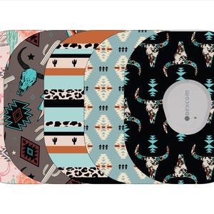 May include: Five different patterned round stickers for a Dexcom G6 continuous glucose monitor. The patterns include a southwestern design with a turquoise and brown color scheme, a black and white cow skull pattern, a turquoise and brown geometric pattern, a turquoise and brown striped pattern, and a pink and brown cactus pattern.