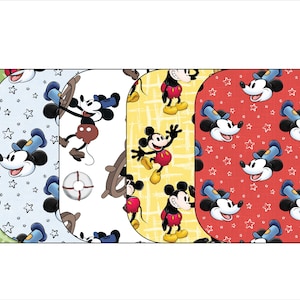 May include: Four different Mickey Mouse designs on fabric squares. The designs include Mickey Mouse with an anchor, Mickey Mouse with stars, Mickey Mouse with a life preserver, and Mickey Mouse with stars.