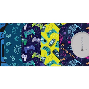 May include: A collection of gaming-themed adhesive patches with various designs. The patches feature game controllers, handheld consoles, and the text "LET'S PLAY" and "GAME ZONE" in a playful font. The patches are in shades of blue, green, and yellow.
