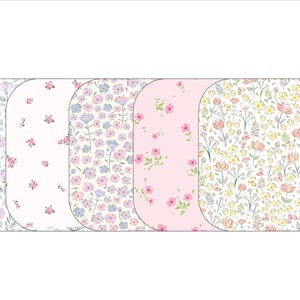 May include: Five floral patterned designs. The patterns include various flowers in shades of purple, pink, and yellow, set against white and light pink backgrounds. The designs are arranged in a row, each with rounded corners.
