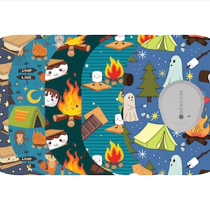 May include: A collection of camping-themed designs featuring s'mores, campfires, tents, and ghosts. The designs are on a medical device, with a gray circular sensor in the center. The backgrounds are various shades of blue.