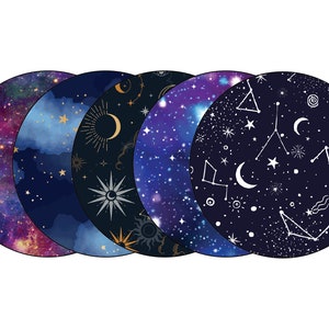 May include: Five round fabric coasters with a dark blue background and white celestial designs. The designs include stars, moons, constellations, and swirls.