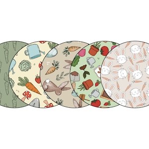 May include: Four round, colorful fabric coasters with different patterns. One coaster has a green background with carrots, another has a yellow background with carrots, a watering can, and a mushroom, another has a brown background with a rabbit, carrots, and a watering can, and the last one has a beige background with white rabbits and carrots.