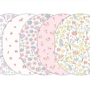 May include: Five oval-shaped floral patterns. The patterns feature various flowers in pastel colors, including pink, purple, blue, and yellow, set against white and light pink backgrounds. The designs include daisies, tulips, and other delicate blooms.