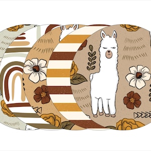 May include: Set of five round coasters featuring a llama with closed eyes, flowers, and abstract patterns in brown, beige, and yellow.