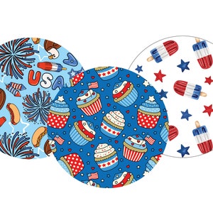 May include: Three round fabric coasters with patriotic designs. The first coaster features a blue background with red, white, and blue fireworks, an American flag, and the word "USA". The second coaster features a blue background with red, white, and blue cupcakes. The third coaster features a white background with red, white, and blue popsicles and stars.
