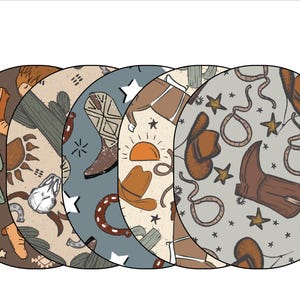 May include: Five round fabric patches with a western theme. The patches feature a variety of designs, including cowboy boots, hats, cacti, stars, and horseshoes. The patches are in shades of brown, blue, and white.