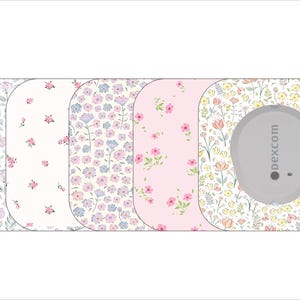 May include: A collection of floral patterned adhesive patches for a medical device. The designs include various pastel floral patterns, with a gray device labeled "dexcom" on the rightmost patch. The patches are rectangular with rounded corners.