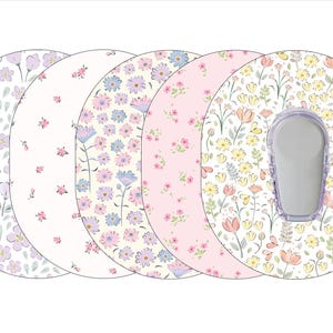 May include: Five different patterned adhesive covers for a medical device. The covers feature floral designs in shades of pink, yellow, and purple.