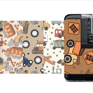 May include: Three different patterns of construction vehicles, airplanes, and stars on a beige background. A brown and black medical device with a clear reservoir and a scale in milliliters. The device has a pattern of construction vehicles, stars, and the words "Big Dig" on a brown background.