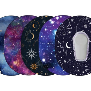 May include: Five round, adhesive stickers with different celestial designs. Each sticker features a dark blue background with white stars, moons, and constellations. The stickers are arranged in a row, with the leftmost sticker featuring a watercolor-style galaxy design.
