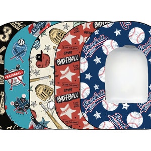 May include: Five different toilet seat covers with baseball themed designs. The designs feature baseballs, bats, stars, and the words "Baseball League".