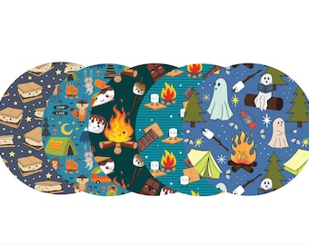 May include: Five circular designs with camping-themed patterns. Each design features illustrations of campfires, marshmallows, s'mores, tents, and woodland creatures like foxes and rabbits. The color palette includes blues, greens, and oranges.