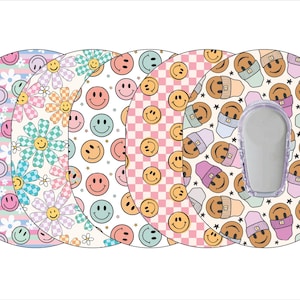 May include: Five colorful round adhesive patches with different smiley face patterns. The patches are designed to cover a medical device.