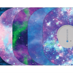 May include: Five different galaxy-themed adhesive skins for a Dexcom continuous glucose monitor. Each skin features a different color scheme of blue, purple, pink, and green with a galaxy pattern.