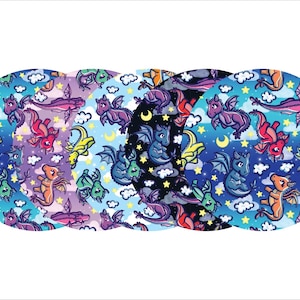 May include: A collection of circular designs featuring a repeating pattern of cartoon dragons, clouds, stars, and crescent moons. The dragons are in various colors, including blue, purple, red, and yellow, set against a gradient background.