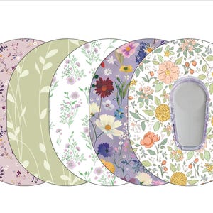 May include: Five different round adhesive patches with floral patterns. The patterns include a light purple with small flowers, a light green with vertical lines, a white with small flowers, a light purple with larger flowers, and a white with larger flowers and a peach colored flower.