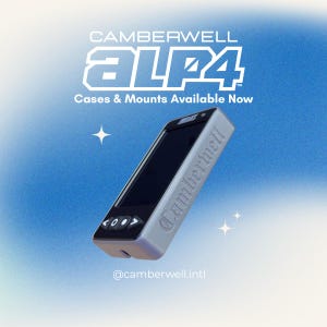 May include: A silver and black electronic device with the text "Camberwell ALP4" and "Cases & Mounts Available Now" on a blue gradient background. The device has a screen and control buttons. The Instagram handle @camberwell.intl is also visible.