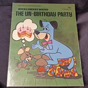 May include: A vintage Huckleberry Hound comic book titled "The Un-Birthday Party." The cover features a light blue cartoon dog with a pink bow tie, a thought bubble with a cake, and two cartoon mice. The background is green.