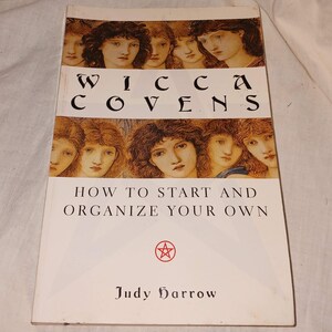 May include: A book titled "Wicca Covenants" with a cover featuring portraits of women. The book's title is in large, bold letters. The cover also includes the text "How to Start and Organize Your Own" and the author's name, Judy Harrow.