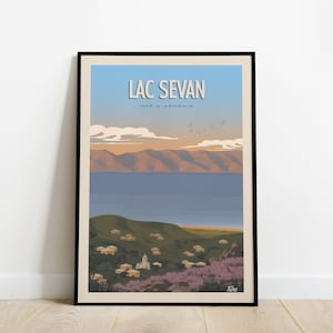 May include: Framed art print depicting Lac Sevan in Armenia. The image shows a lake, mountains, and a village, with the words "LAC SEVAN" at the top. The colour scheme includes blues, greens, and earth tones.