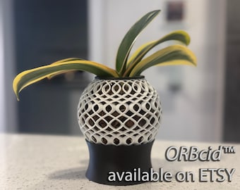 May include: A white, lattice-patterned planter with a black base, holding a plant with green and yellow leaves. The text "ORBcid™ available on Etsy" is visible on the bottom right.