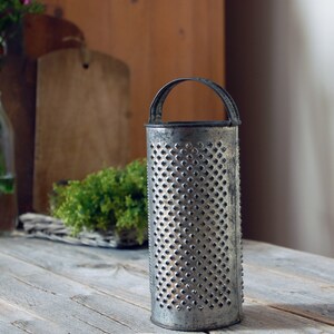 vintage round metal cheese grater