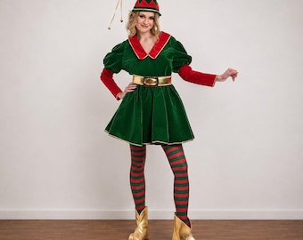 May include: A green velvet dress with red collar and cuffs, paired with a matching green elf hat featuring a gold bell. The outfit includes red and green striped leggings and metallic gold pointed shoes, accented by a gold belt at the waist.