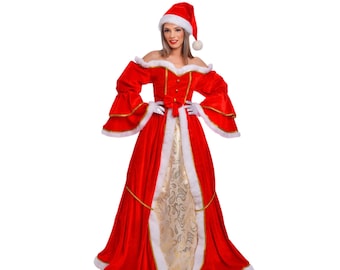 Könnte beinhalten: Eine Frau in einem roten Samt- und weiß-fellbesetzten Weihnachtskleid mit goldener Verzierung und einem gold-weiß gemusterten Rock. Sie trägt eine rote Weihnachtsmütze mit einem weißen Bommel.