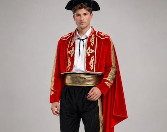 May include: A matador costume featuring a red velvet bolero jacket with gold embroidery, a matching red cape, a white collared shirt with a black tie, a gold sash, black knee-length trousers with gold side stripes, white tights, and a black hat.