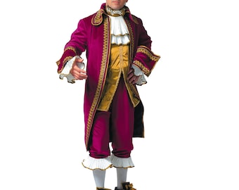May include: A burgundy and gold historical costume. The outfit includes a long coat with gold trim, a ruffled white shirt, gold vest, and matching breeches. The costume is completed with a white wig and black shoes.