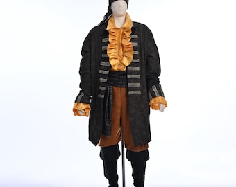 May include: A pirate costume on a mannequin. The costume includes a black coat with gold trim, a ruffled yellow shirt, brown shorts, black boots, and a black headscarf. The coat has multiple gold buttons.