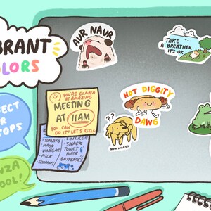 May include: A laptop with colorful stickers on it. The stickers feature illustrations of animals, food, and text. The text on the stickers includes "You're gonna be amazing Meetin G at 11am", "Hot Diggity Dawg", "Just Doin My Thing", "Take a breather. It's ok", "Aur Naur", and "Always Confuse Their Very".