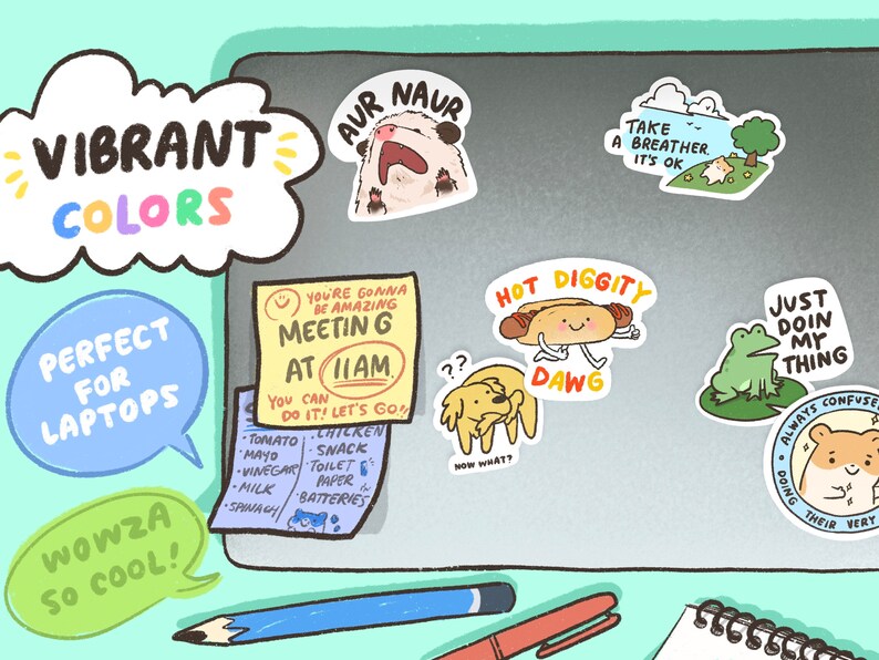 May include: A laptop with colorful stickers on it. The stickers feature illustrations of animals, food, and text. The text on the stickers includes "You're gonna be amazing Meetin G at 11am", "Hot Diggity Dawg", "Just Doin My Thing", "Take a breather. It's ok", "Aur Naur", and "Always Confuse Their Very".