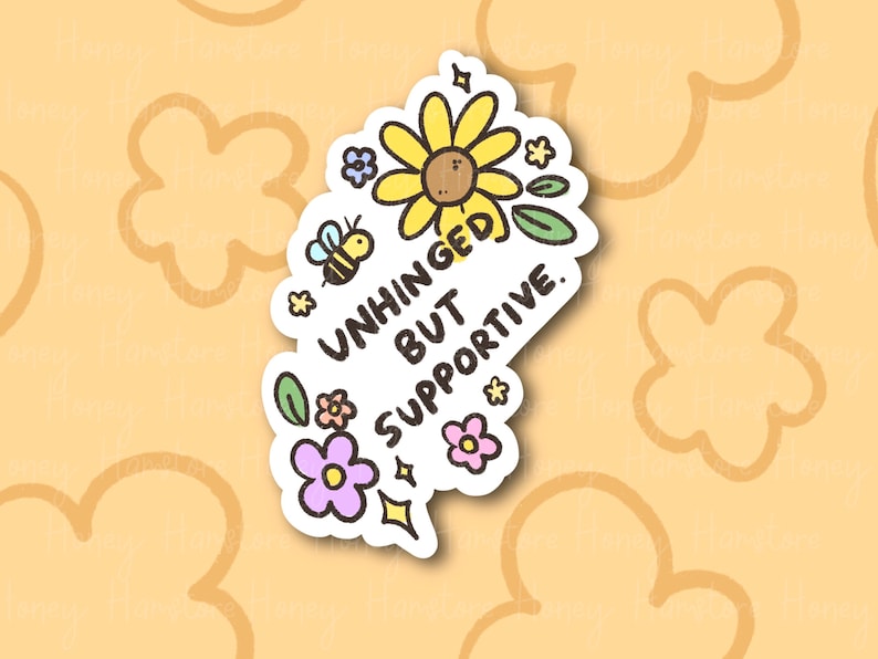 Peut inclure: Un autocollant blanc avec un tournesol jaune, une abeille et des feuilles vertes. Le texte sur l'autocollant est "Unhinged but supportive."