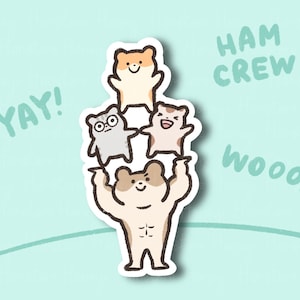 May include: A sticker featuring a stack of four cartoon hamsters. The bottom hamster is tan with visible abs, supporting the others. The top hamsters are light brown, gray, and tan. Text includes "YAY!", "HAM CREW", and "WOOO!" on a light blue background.