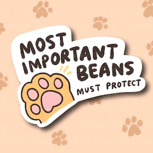 May include: A white sticker with a paw print and the text "Most Important Beans Must Protect" in black lettering.
