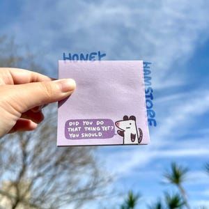 May include: A lavender sticky note with the text "DID YOU DO THAT THING YET? YOU SHOULD." and a cartoon opossum illustration. The word "HONEY" is above the note and "HAMSTORE" is on the side.