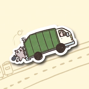 May include: A cartoon illustration of a green garbage truck with a raccoon driving and a raccoon hanging out the back door. The truck is driving down a road with two trash cans on the side.