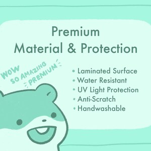 May include: A cartoon hamster with the words "Wow So Amazing Premium" above it. The text below the hamster reads "Premium Material & Protection" and lists the following features: Laminated Surface, Water Resistant, UV Light Protection, Anti-Scratch, and Handwashable.