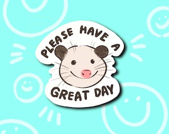 May include: A white sticker with a cartoon possum face and the text "Please have a great day".