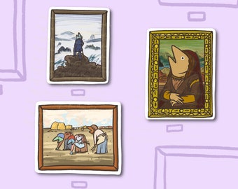 May include: Three framed pictures on a purple wall. The first picture shows a person standing on a rock in a snowy landscape. The second picture shows a woman with a fish head in a landscape. The third picture shows a group of people in a field.