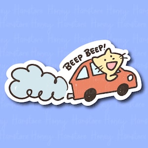 May include: A sticker featuring a cartoon cat driving a red car with a white cloud of smoke behind it. The text "BEEP BEEP!" is written above the car.