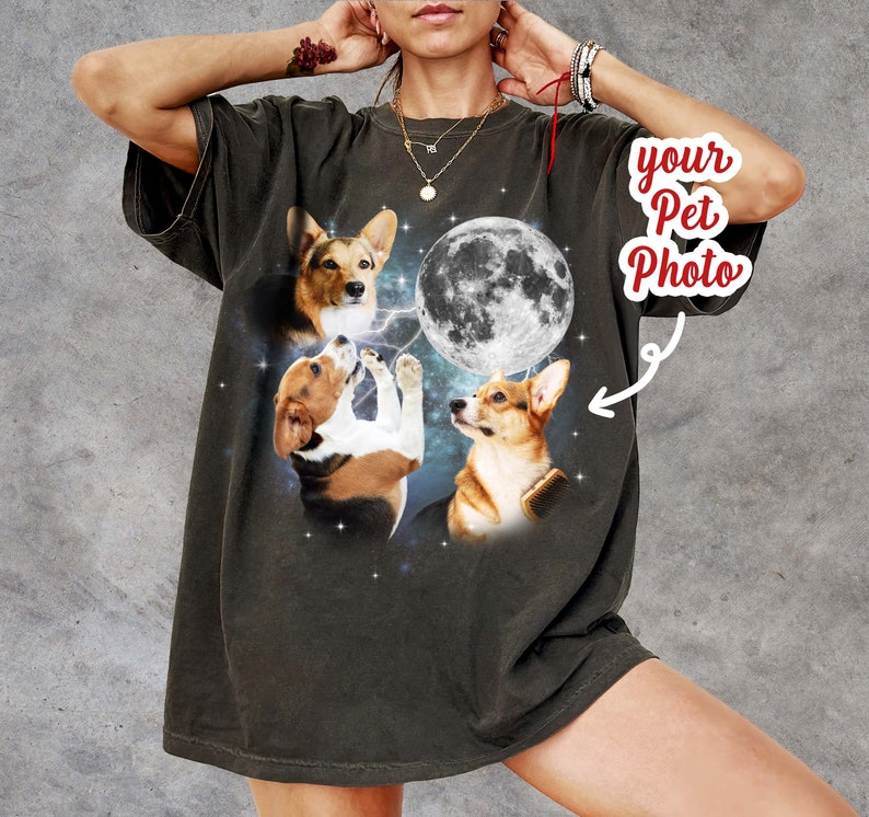 May include: A dark gray oversized t-shirt with a graphic print of three dogs howling at the moon. The text "your pet photo" is in a red circle with an arrow pointing to the moon.