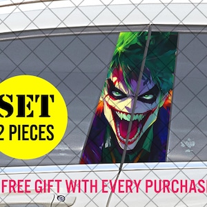 May include: A car window decal set featuring a vibrant illustration of the Joker with green hair, red lips, and a sinister grin. The image is set against a car window, with a yellow circle that says "SET 2 PIECES".