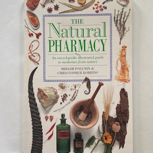 May include: Book cover with the title "The Natural Pharmacy: An encyclopedic illustrated guide to medicines from nature" by Miriam Polunin & Christopher Robbins. The cover features a variety of natural ingredients and objects, including herbs, flowers, roots, and a mortar and pestle.